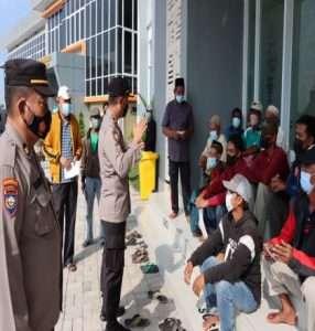 Polres Gresik Pastikan Penerapan Prokes dalam penyaluran BTPKLW
