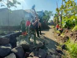 Cuaca Bukan Penghalang Semangat Kemanunggalan Satgas TMMD Dan Masyarakat