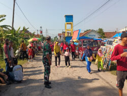 Pastikan Berjalan Aman Dan Lancar,Anggota Pos Koramil Gerih Amankan Jalan Sehat Warga