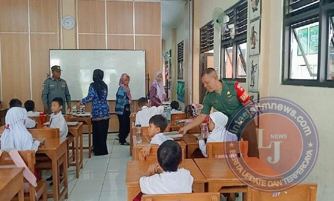 Serka Sudiyono Bantu Pendistribusian Program Pemerintah Makanan Bergizi Gratis (MBG) di SDN 59 Joyotakan